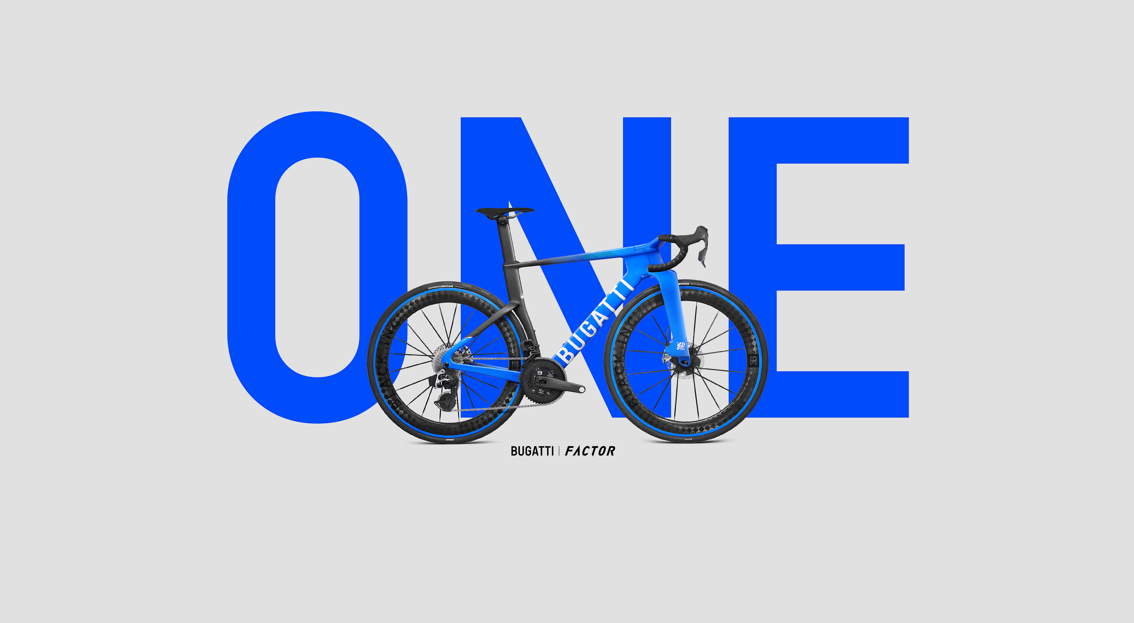 The Bugatti Factor ONE bicycle superimposed in front of ONE written in large blue letters.