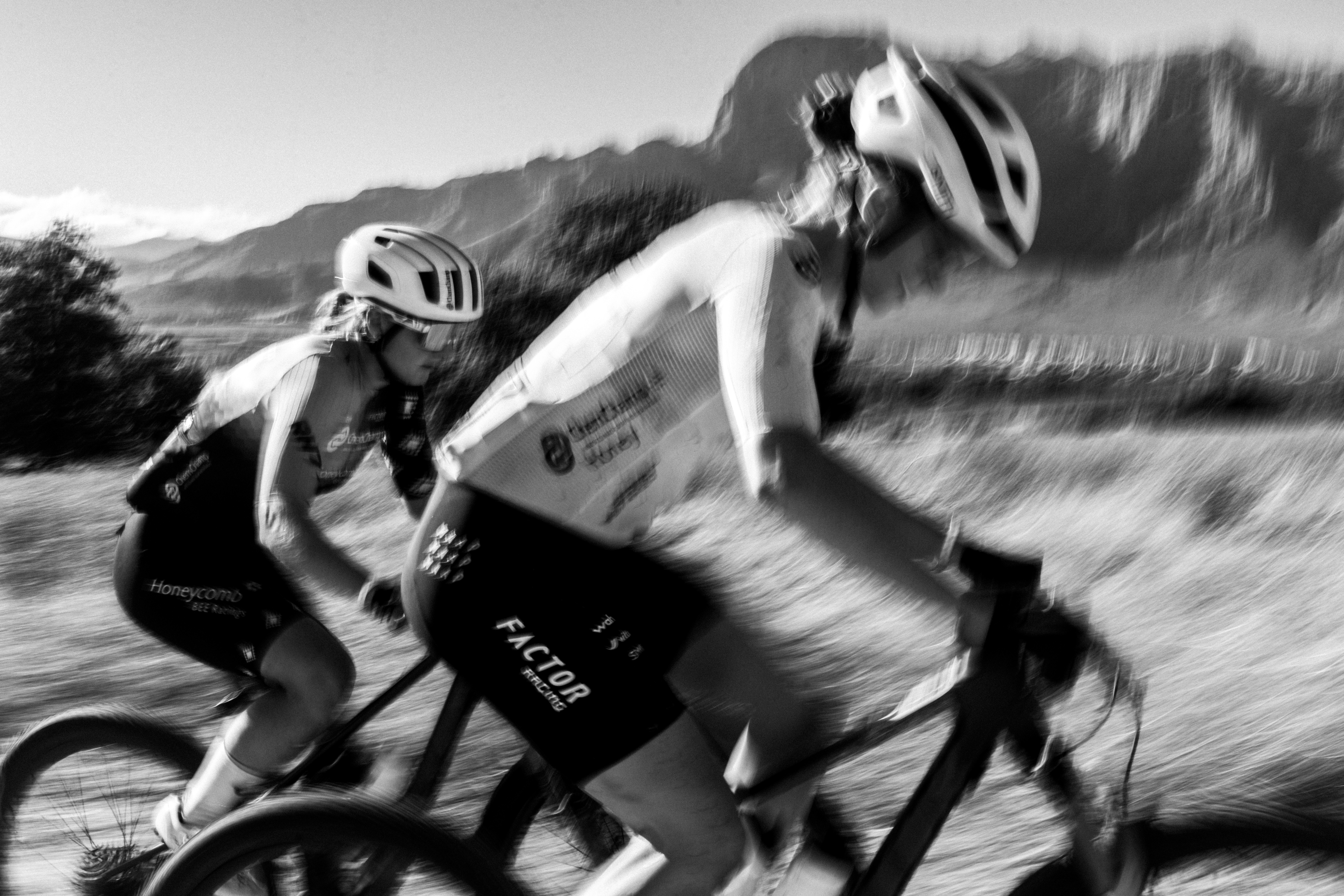 Black & white photo of Haley Hunter Smith & Hayley Preen racing on their Factor LANDO XC mountain bikes at Cape Epic 2026