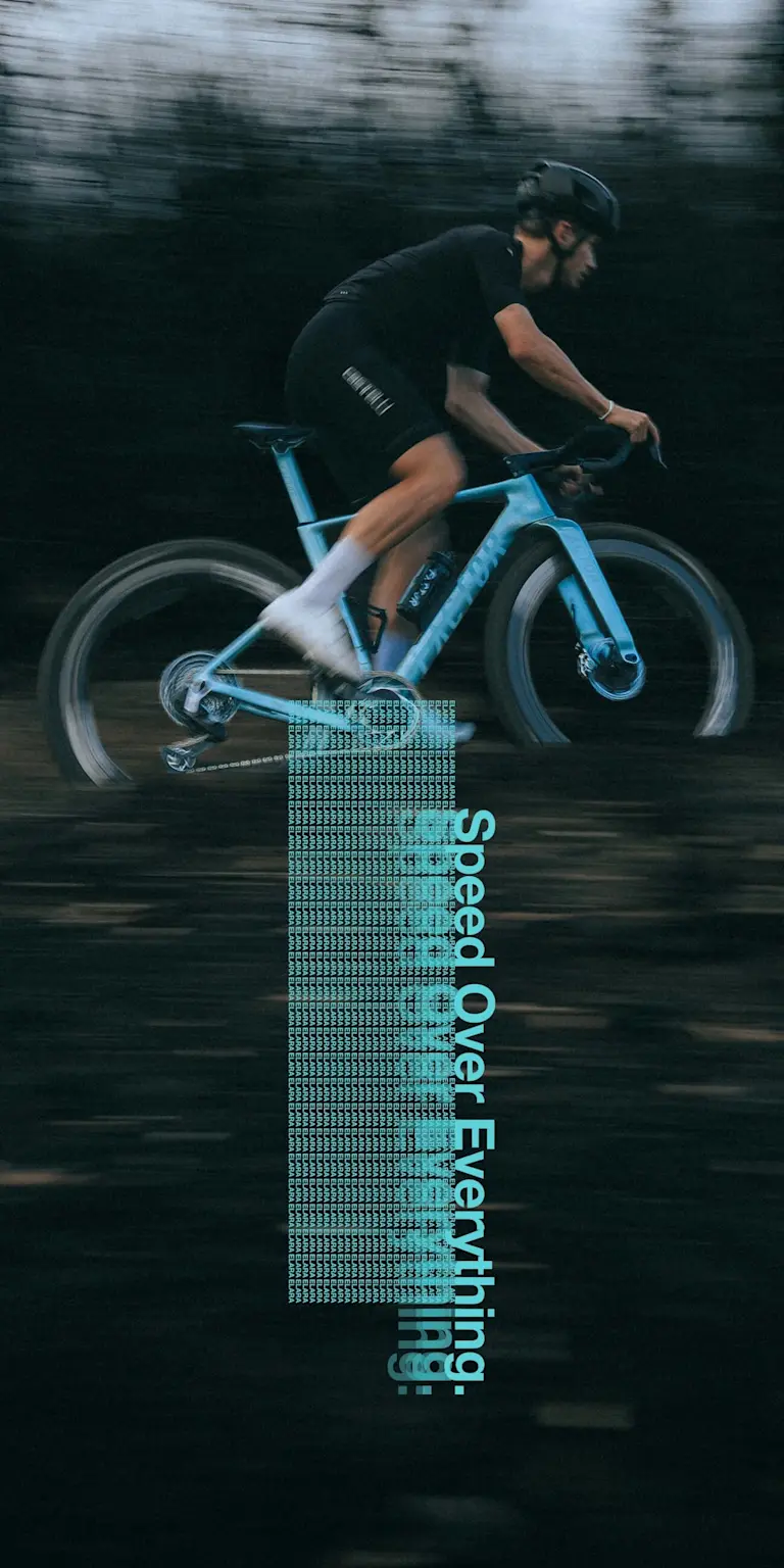 An ELARA closeup in Virescent Blue ridden on a moody gravel path. Darker tones of the path make the bike colour stand out.