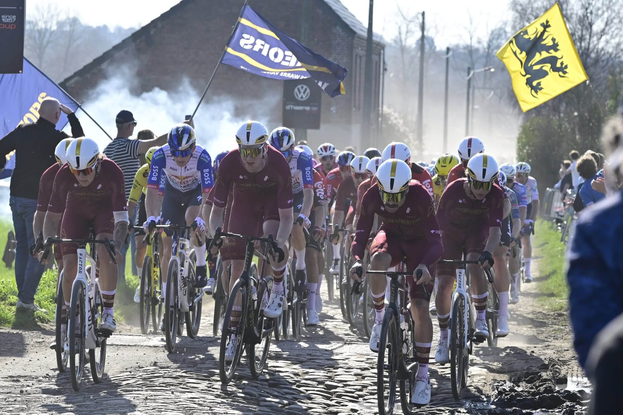 Modern Adventure Pro Cycling lead the peloton across Belgian cobbles on their Factor bikes
