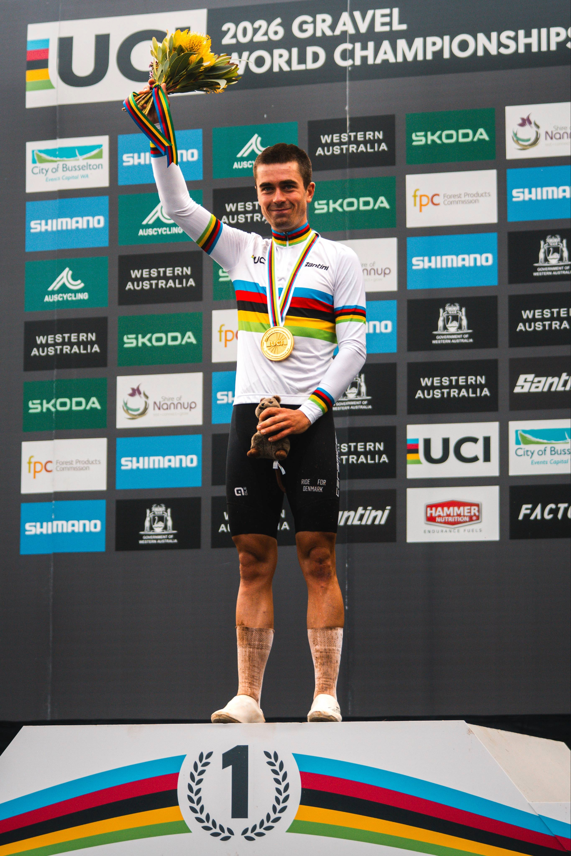 Magnus Bak standing on the podium after winning the UCI Gravel Worlds 2026