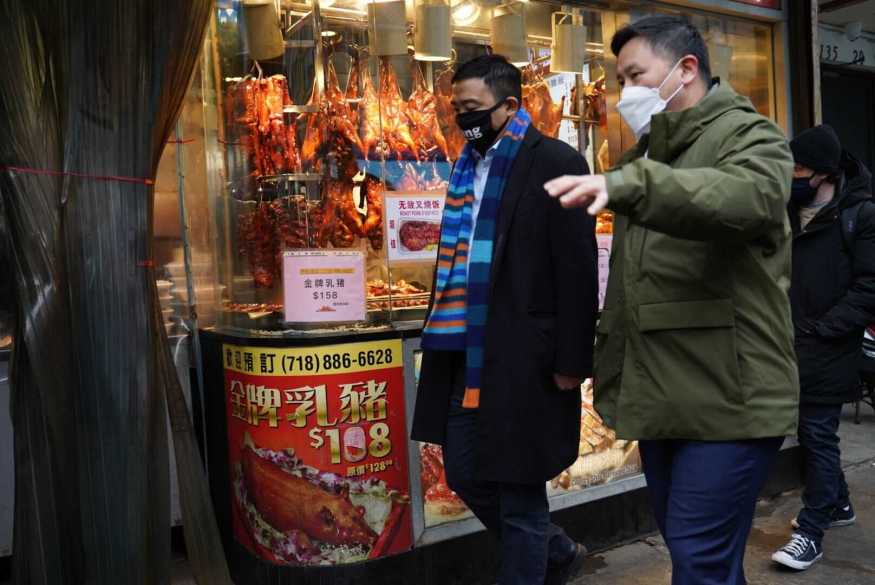 Andrew Yang and Ron Kim walk and talk on the streets of Queens during the campaign for Mayor of NYC