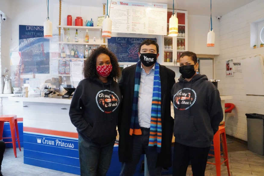 Andrew Yang meets with the owners of The Crabby Shack in Brooklyn. Courtesy of Yang For New York.