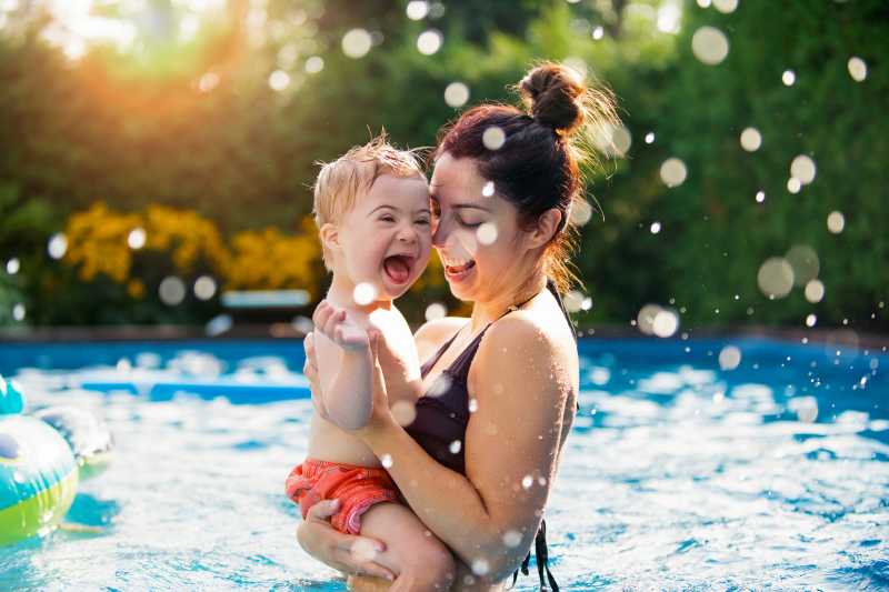 Baby and mother in a pool