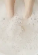 Soak feet in a warm water bath with 1-2 pumps of Soften Up Pedi Soak