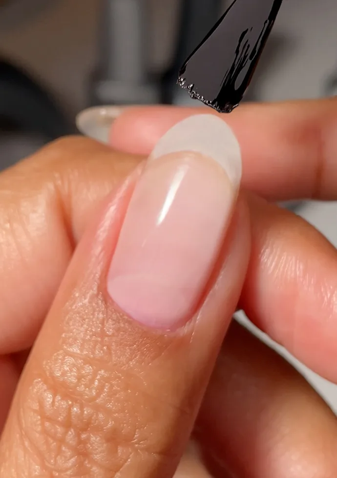 Apply a thin coat of GELement Base Coat to nails