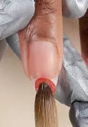Pick up a medium-wet bead of Absolute Acrylic or Powder Perfection Powder and place it in the center of the nail