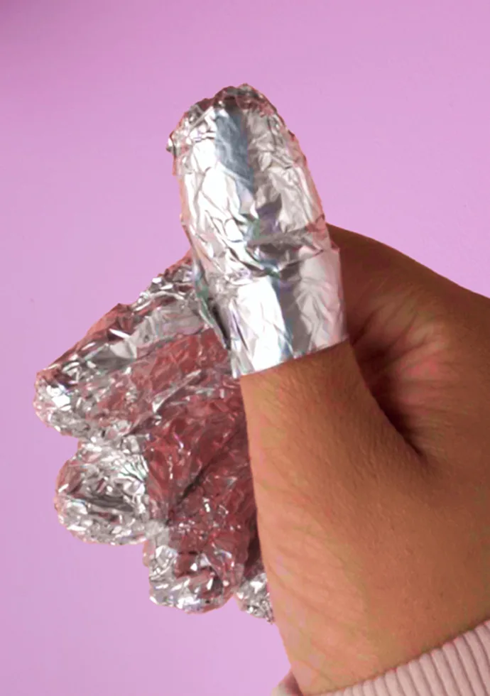 How is gel nail polish removed?