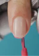 Apply a thin coat of color, starting by capping the free edge to seal