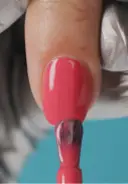 Apply a second thin coat of color, starting by capping the free edge to seal