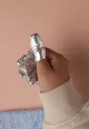 WRAP: Wrap one side around the finger and then the other. Tighten  the wrap.