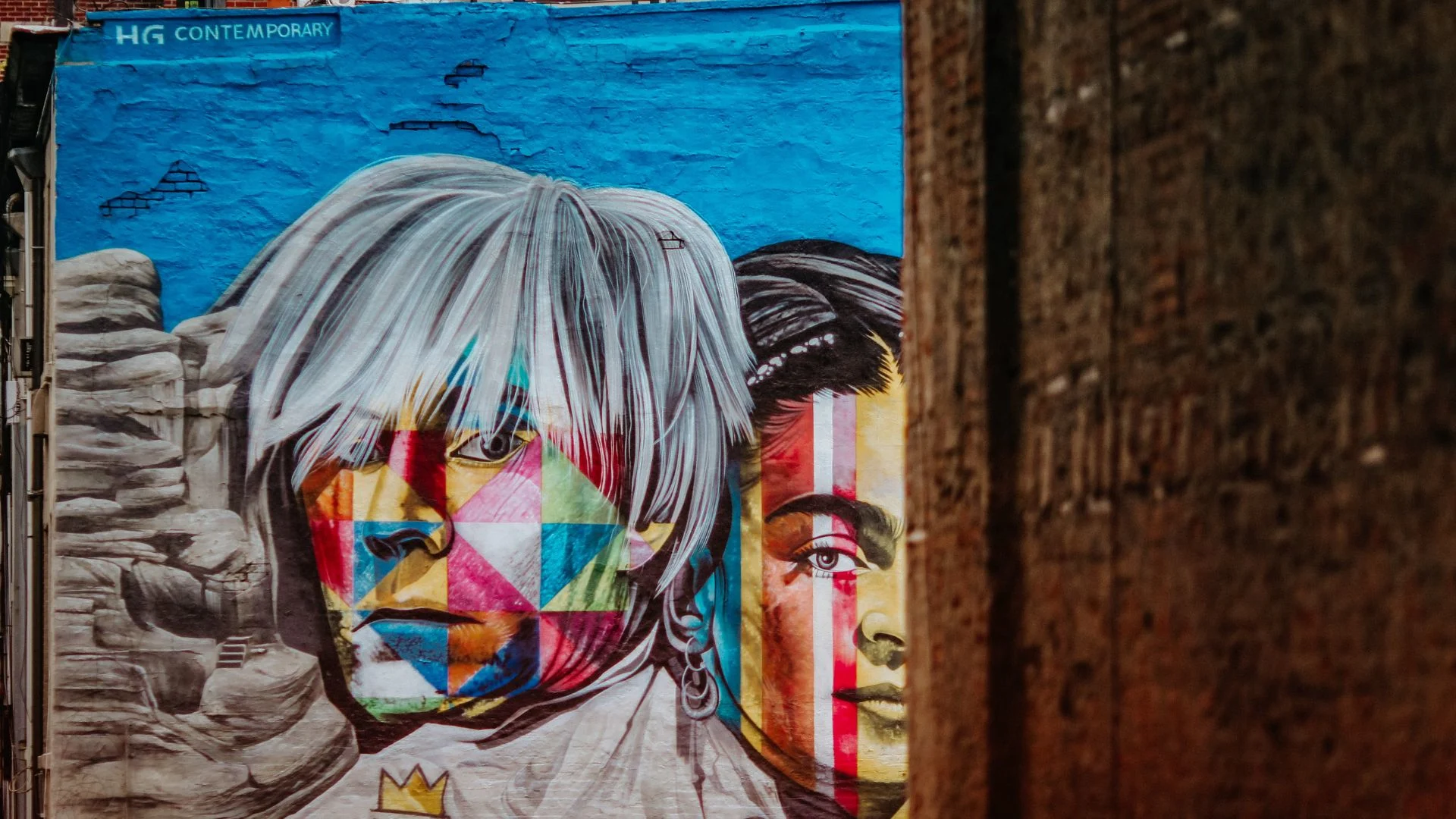 Graffiti of Andy Warhol's face on a building. Source: Jon Tyson / Unsplash