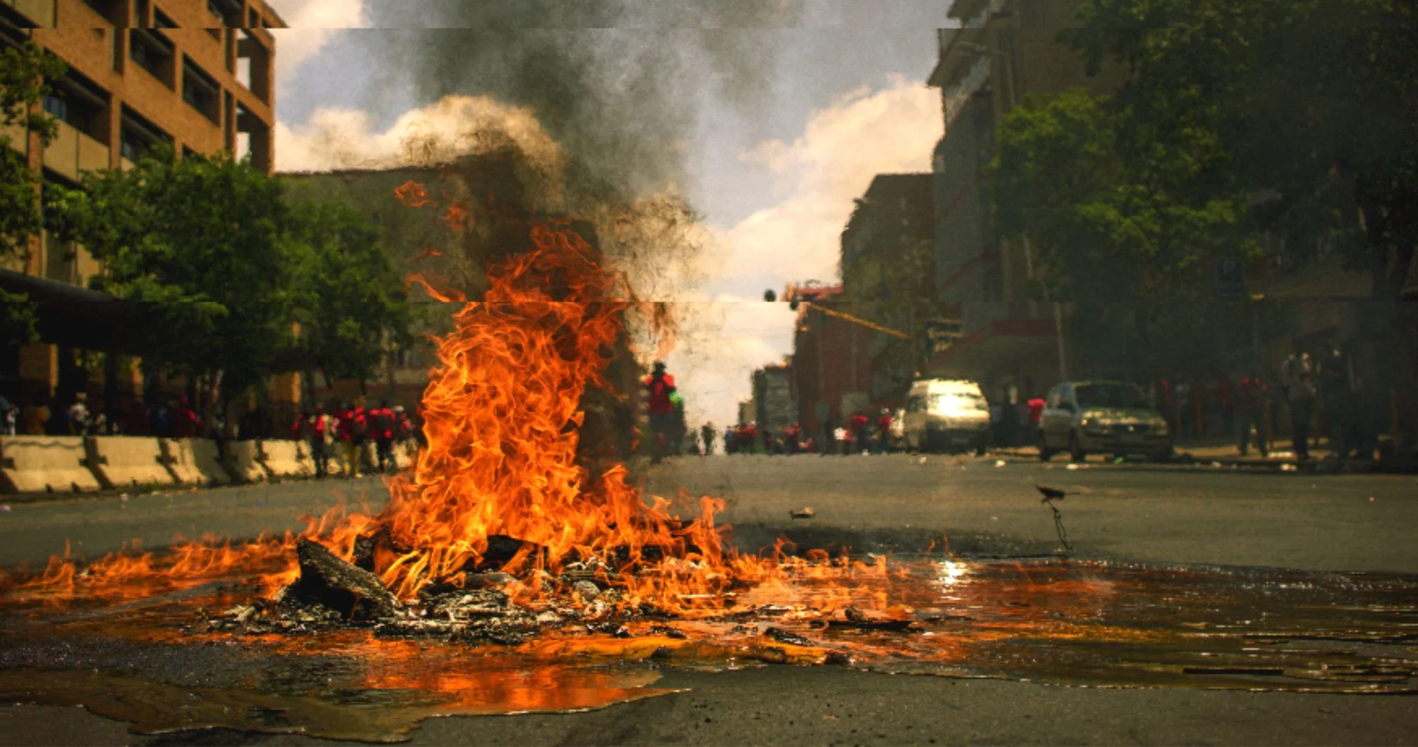 A pile of junk burning in a road. Source: Pawel Janiek / Unsplash