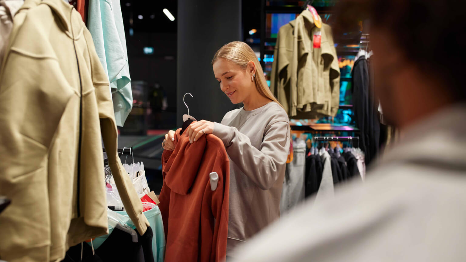 woman shopping hoodies 1