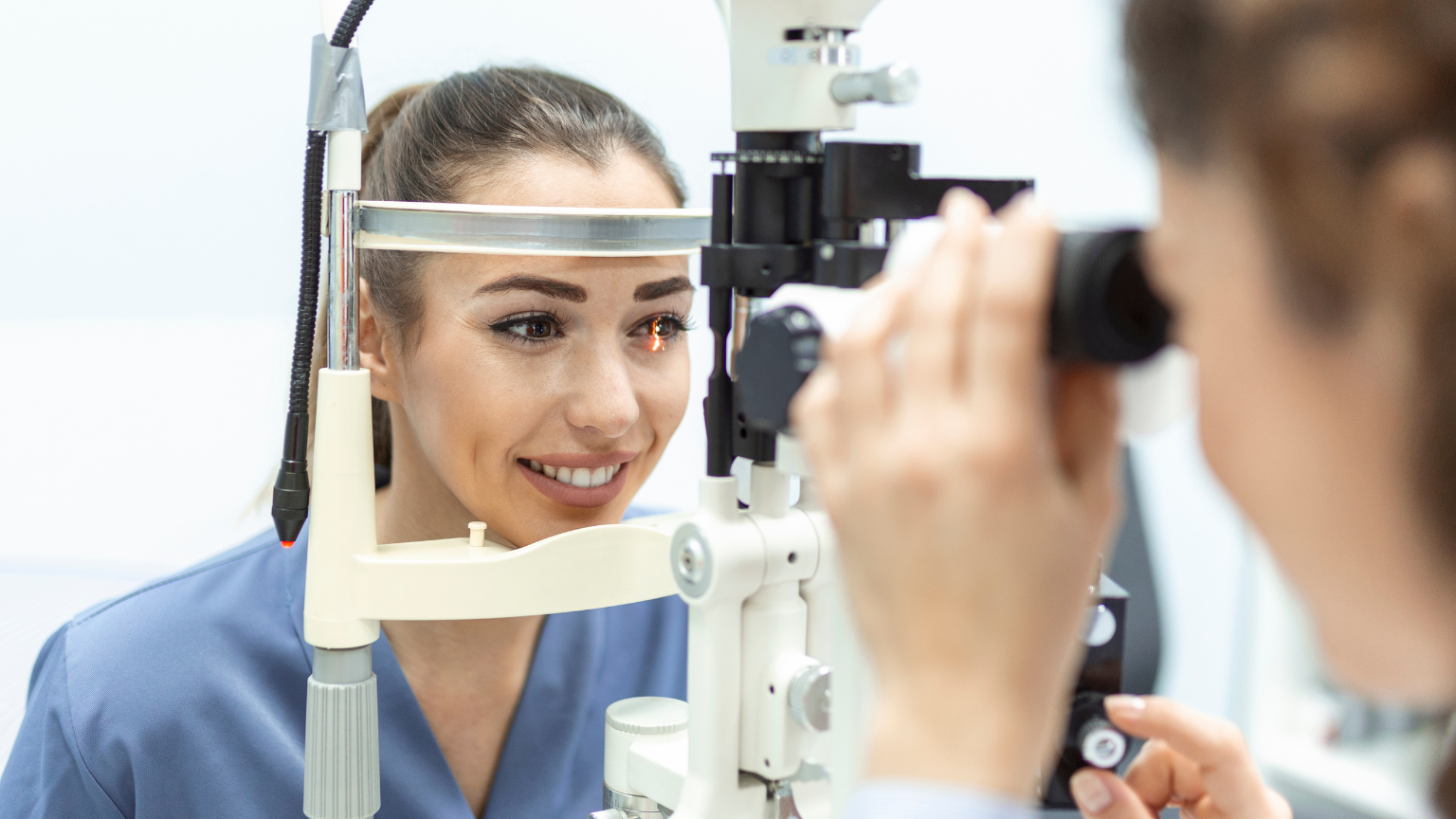 Eye doctor with female patient