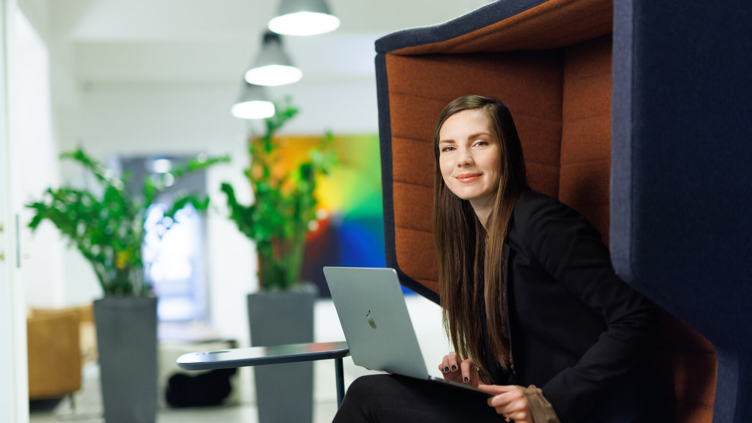woman sitting in a booth