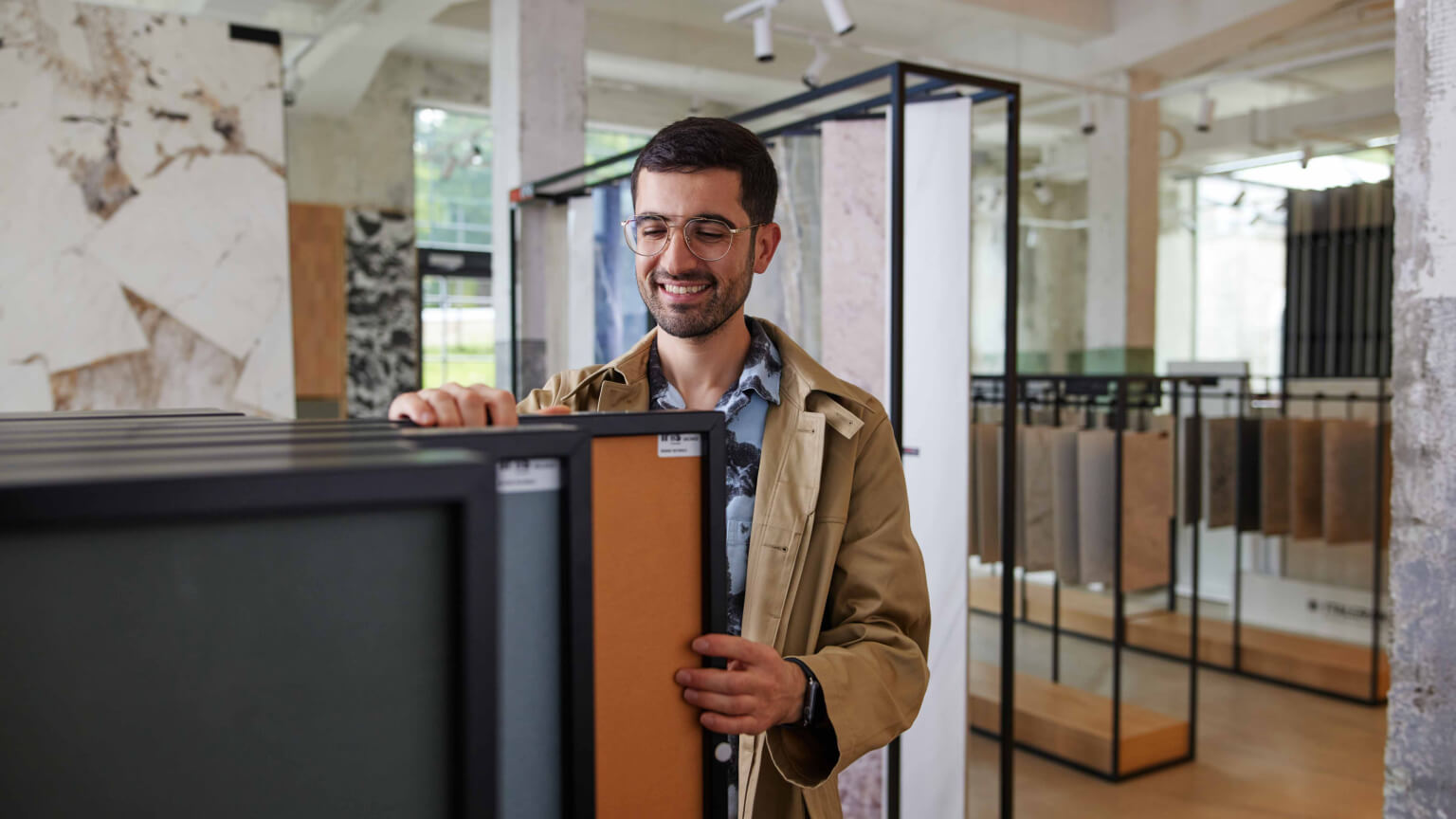 man-smiling-in-store-wide