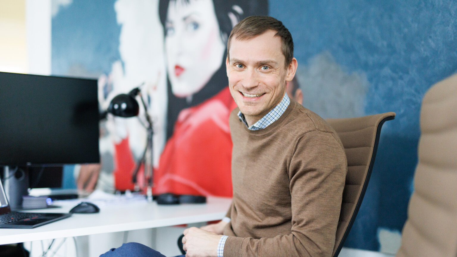 man smiling to a camera