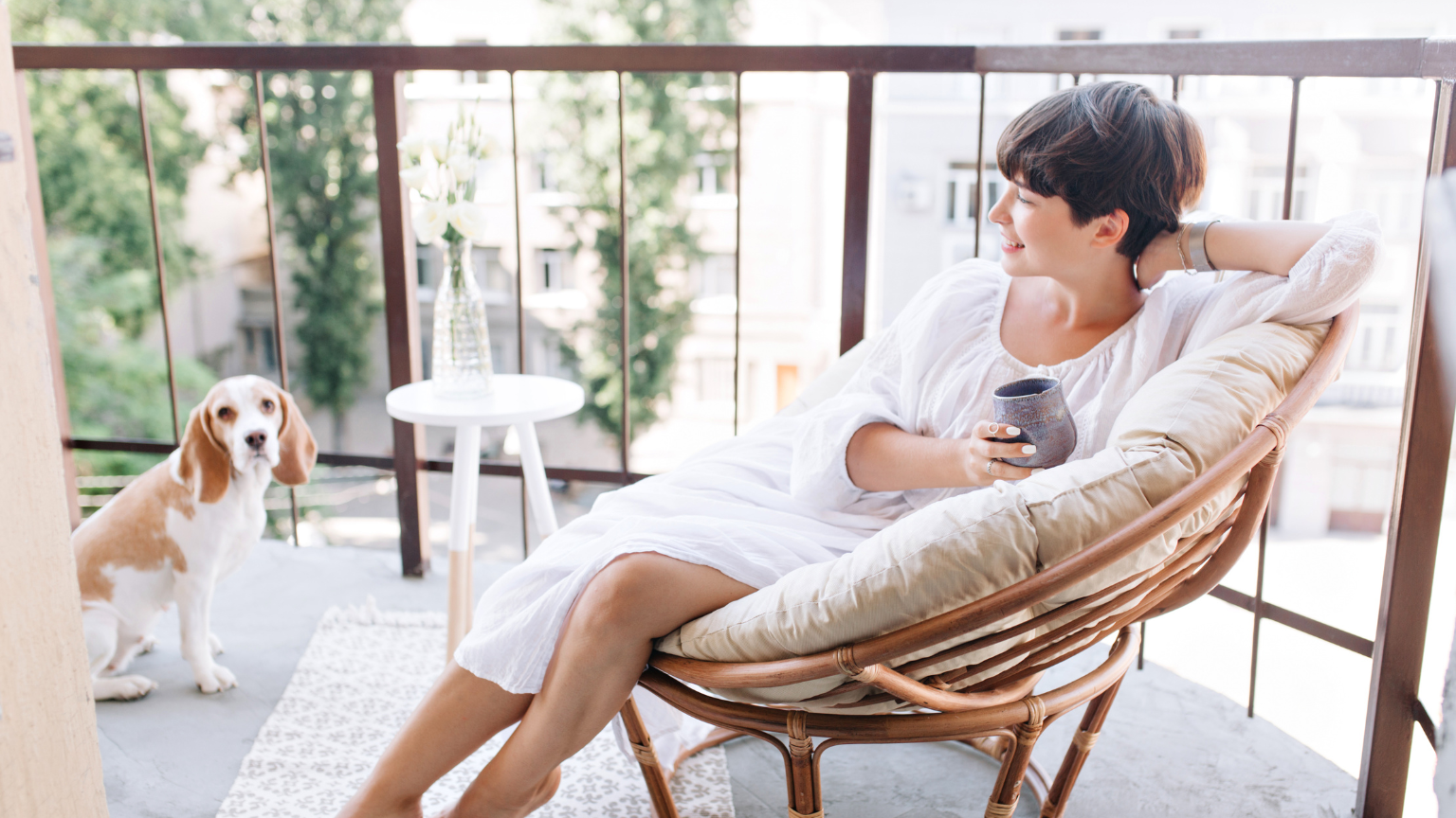 Women sitting in chair on balcony