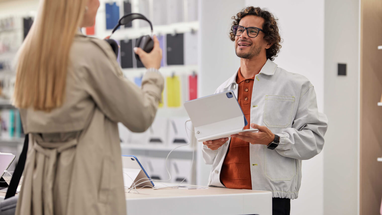 woman trying on headphones