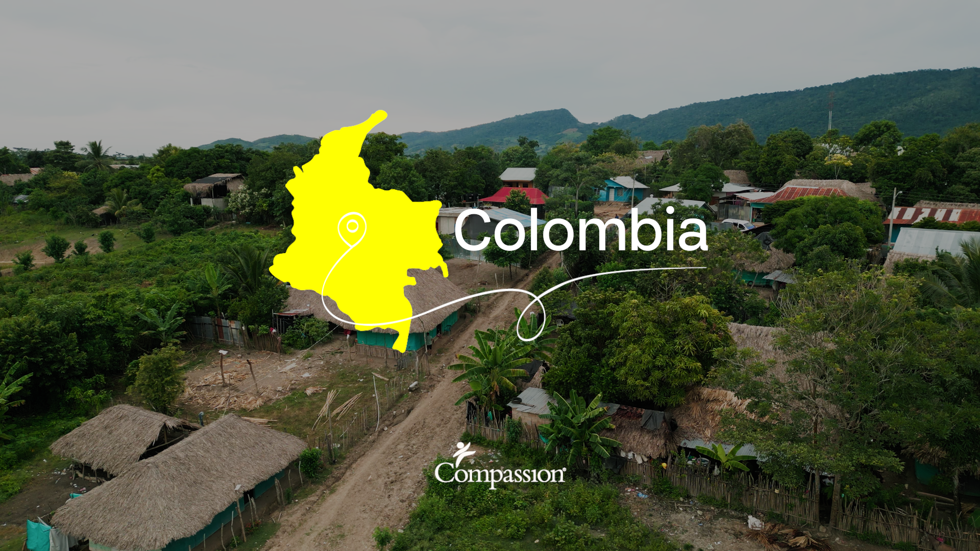 A city landscape with a country outline and name "Colombia" superimposed on top.