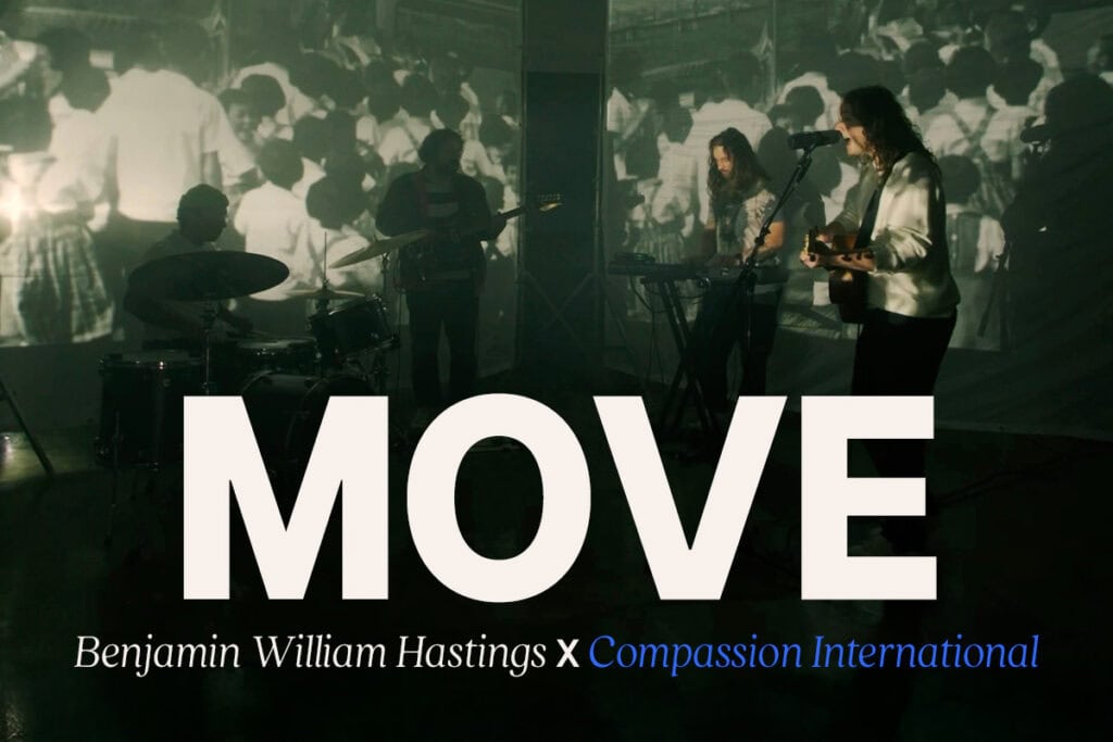 An image featuring a band in the background with the words "Move" in big letters.