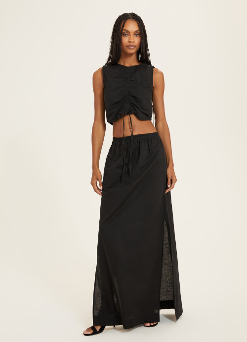 Model in Cinched Top Black and Skirt with Slits