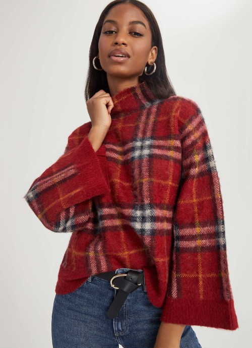 Model in red Something Navy Plaid Turtleneck Sweater