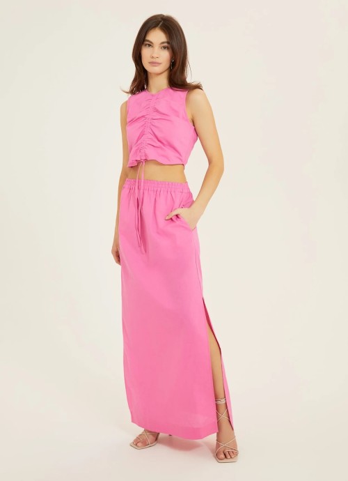 Hot pink maxi skirt with slits and cinched crop top