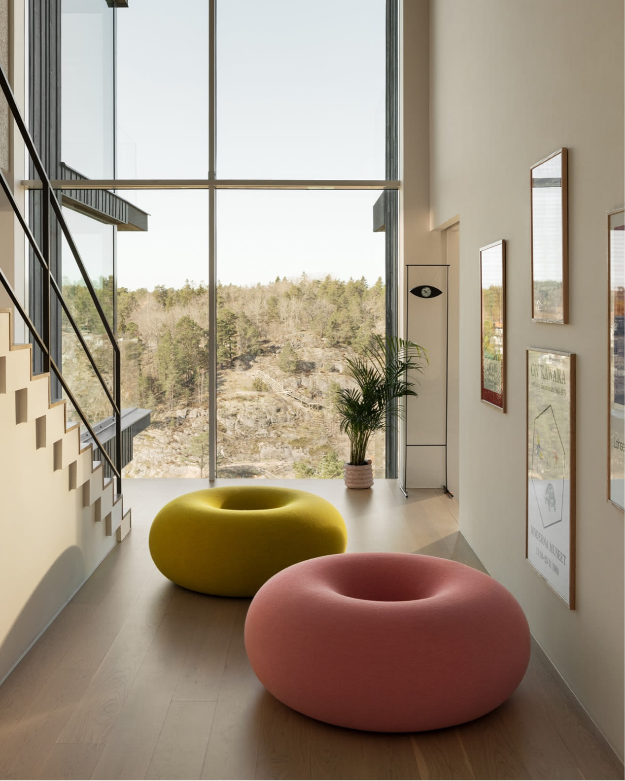 Hem - A lifestyle image of a hallway featuring two Boa Poufs in Sulfur Yellow and Cotton Candy.