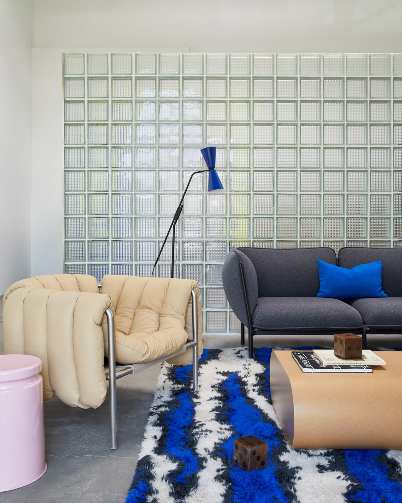 Image of the Hem LA Showroom featuring Puffy Lounge Chair, Alphabeta Floor Lamp, Monster Rug, Kumo Sofa, Storm Cushion, Last Stool and Stump Coffee Table.