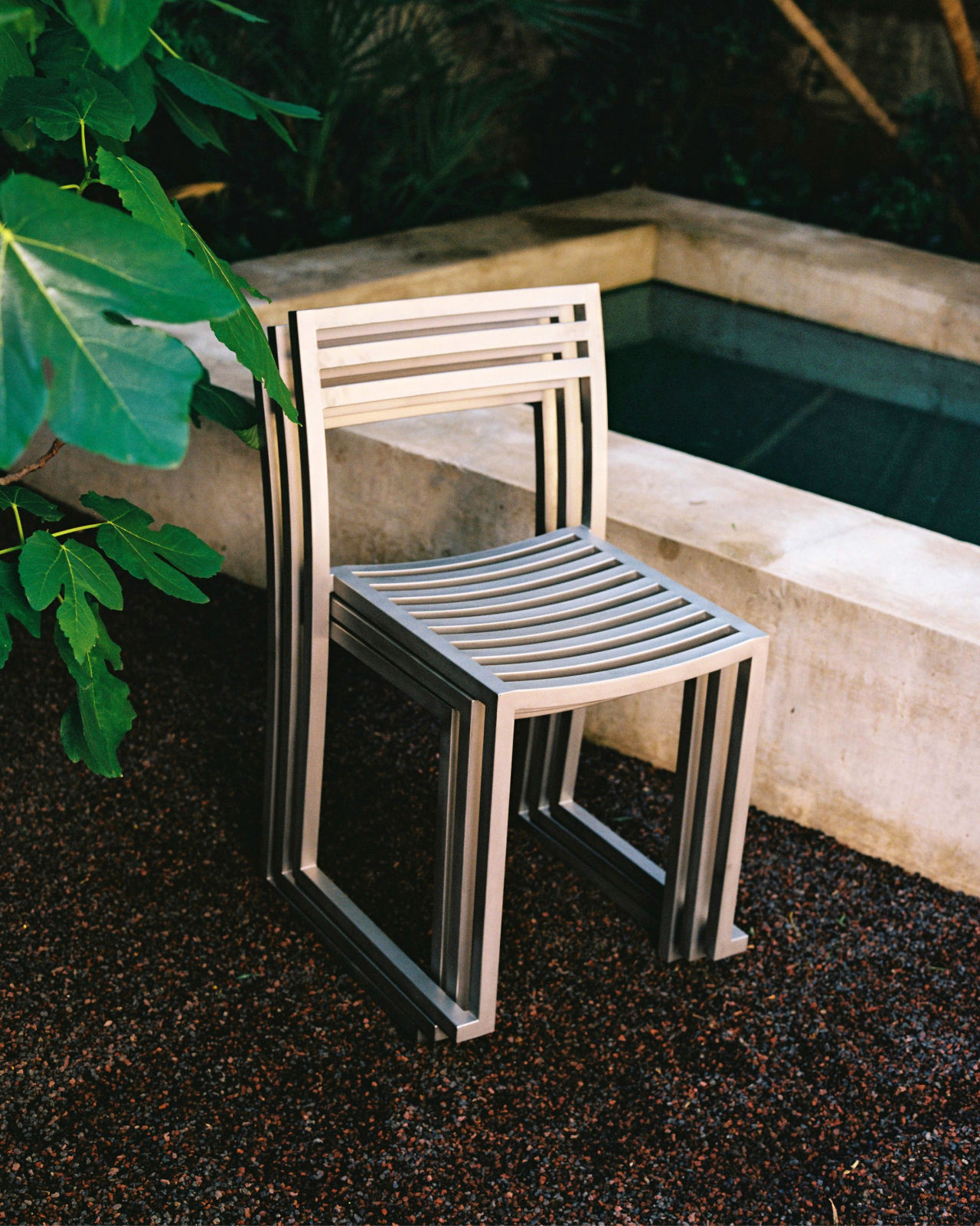 A lifestyle image of an outdoor scene featuring Chop Chairs.