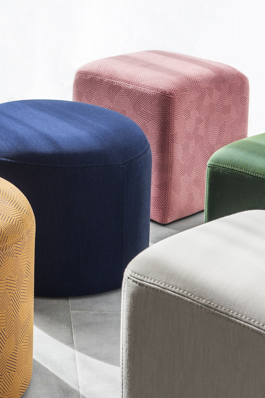 A lifestyle image featuring Bon Pouf Round and Bon Pouf Cube.