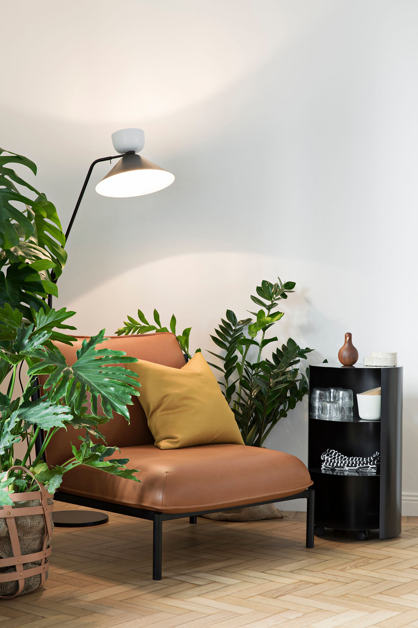 An editorial image of a lounge scene featuring Kumo Modular Sofa, Hide Pedestal, and Alphabeta Floor Lamp.