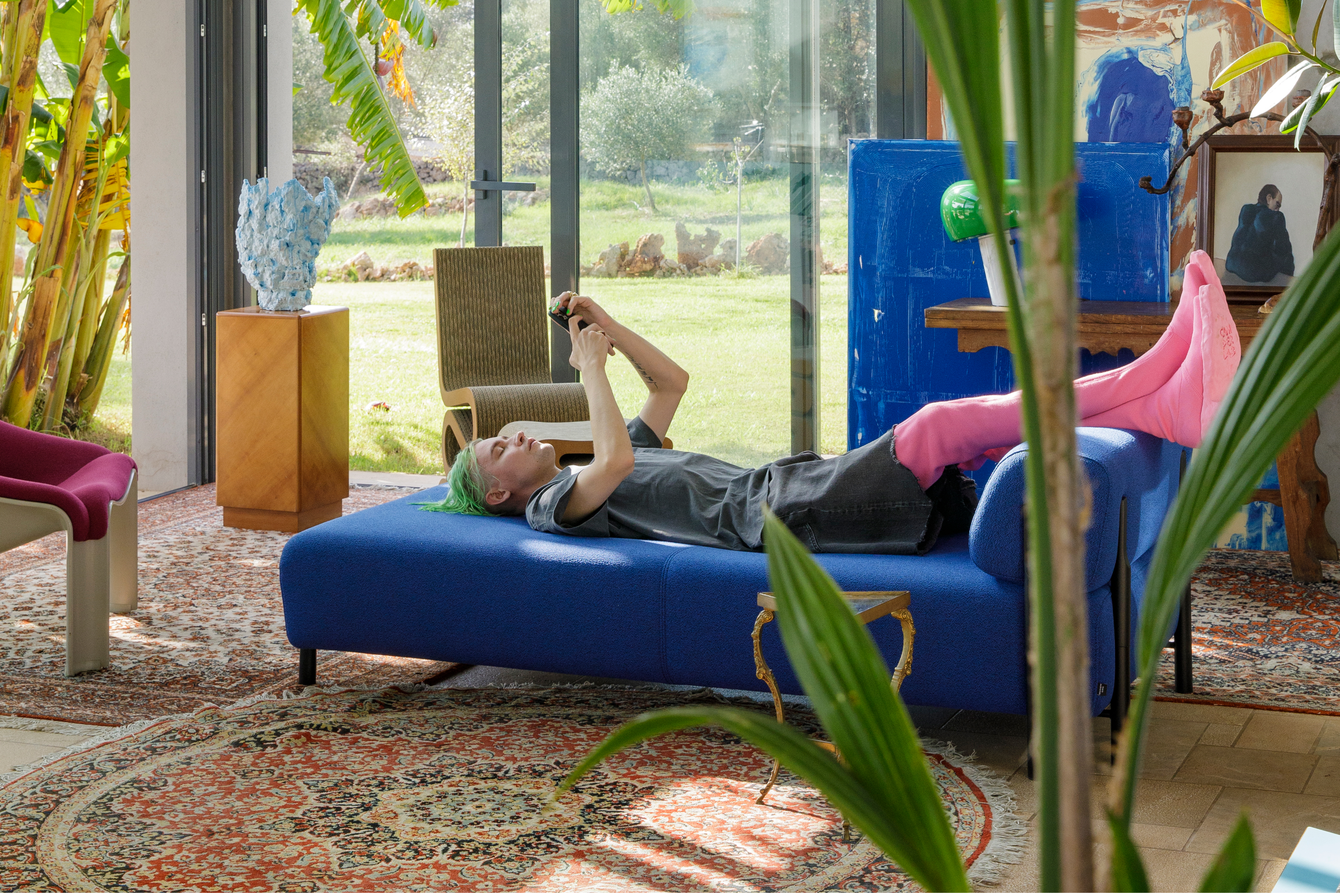 Achilles resting on our [Palo Modular Lounger Cobalt](/furniture/sofas-and-poufs/palo/20364)