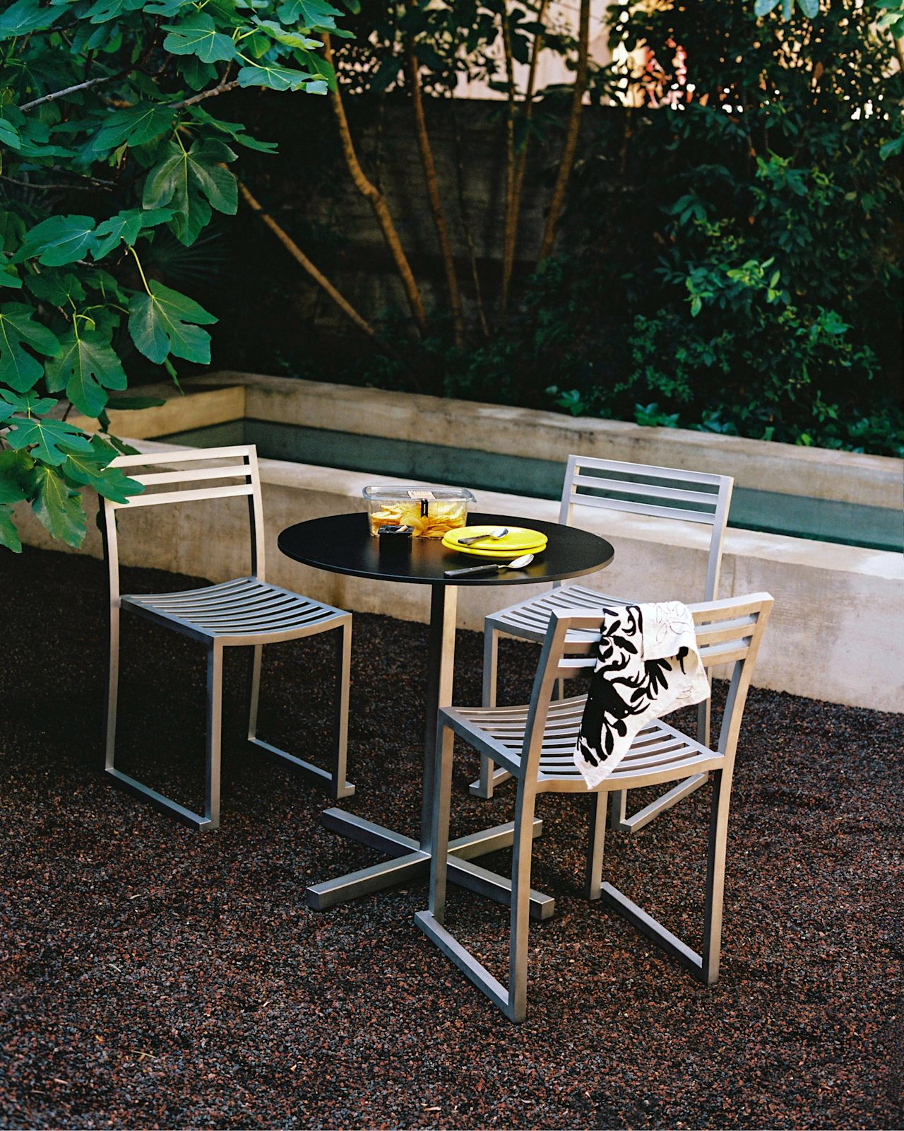 A lifestyle image of an outdoor scene featuring the Chop outdoor collection.