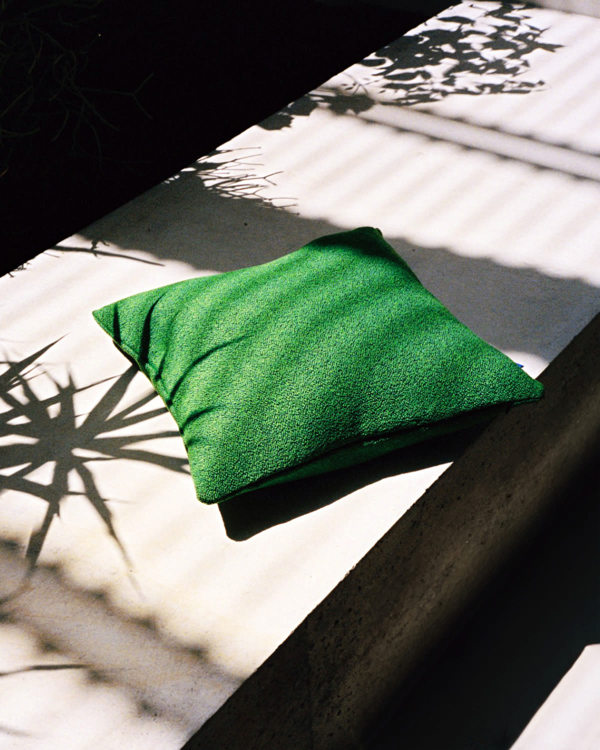 A lifestyle image featuring Crepe Cushion Medium in Pure Green.