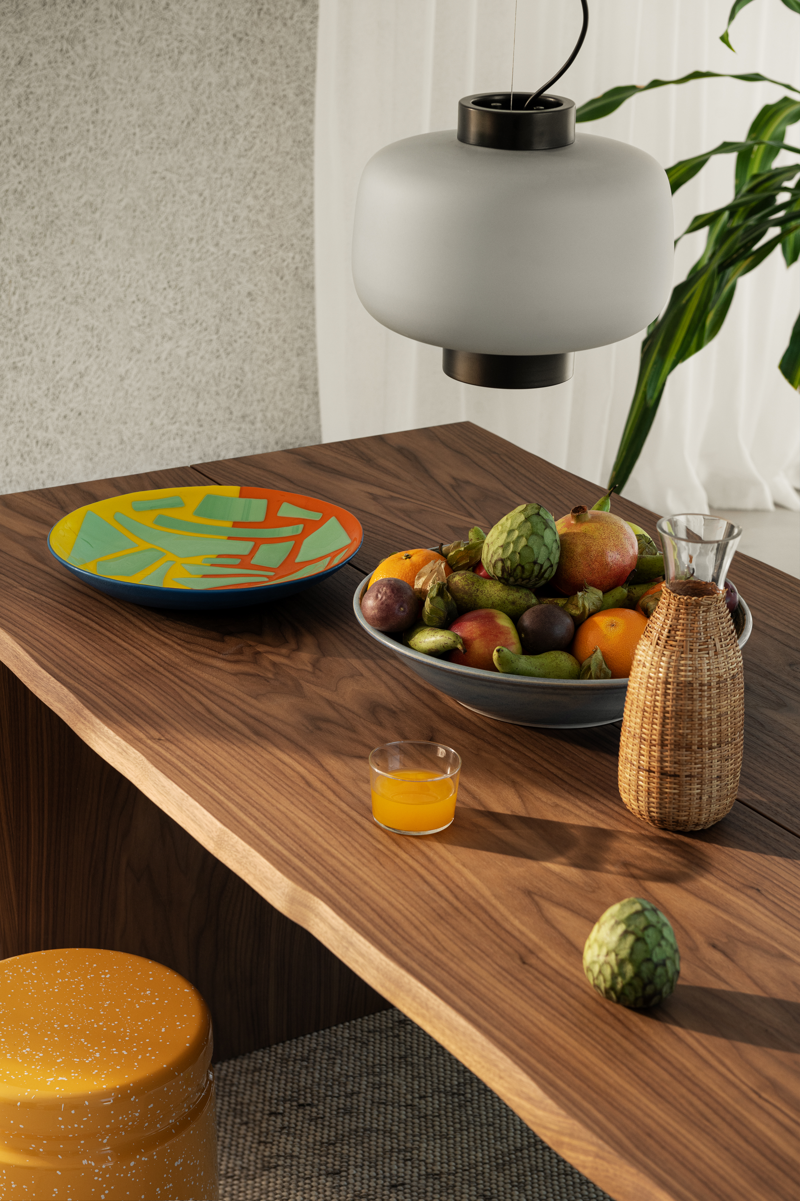 A lifestyle image of a dining scene featuring Dusk Lamp, Bookmatch Table + Benches Set, Offcut Plate, Last Stool, and Dune Rug.