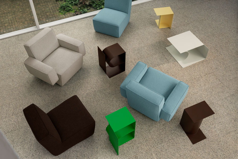 A lifestyle image featuring Hunk Lounge Chair, Hunk Lounge Chair with Armrests, and Glyph Side Tables Alpha, Beta and Gamma.