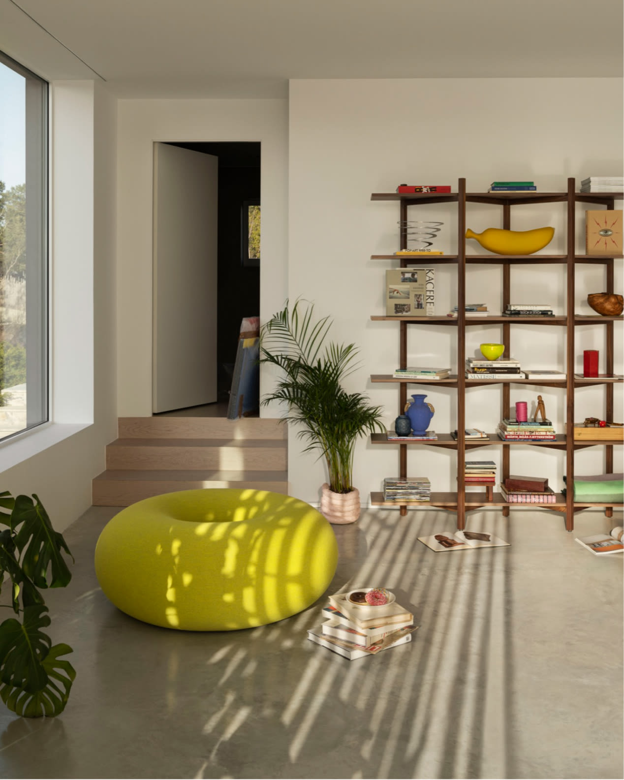 Hem - A lounge room featuring Boa Pouf in Sulfur Yellow and Zig Zag High Shelf in Walnut.