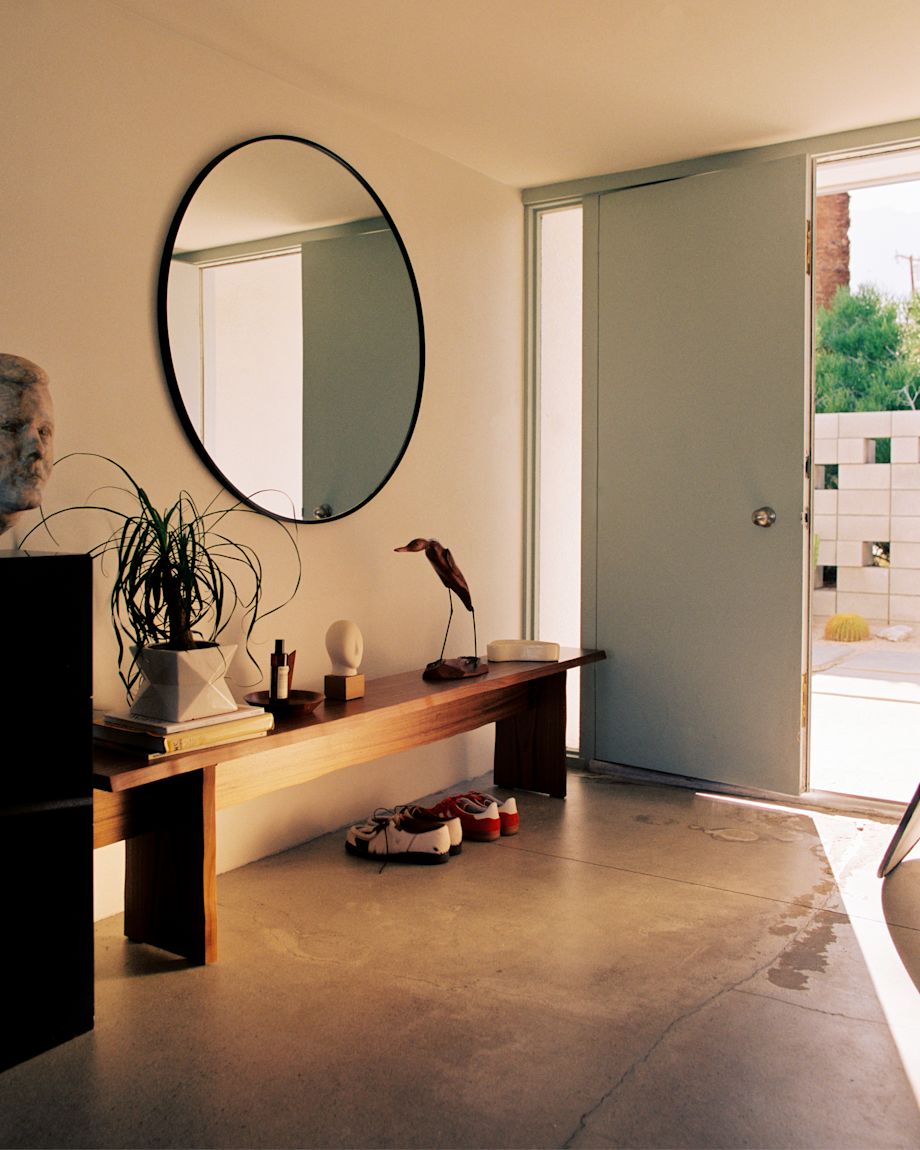A lifestyle image of a hallway scene featuring Bookmatch Bench in Walnut.