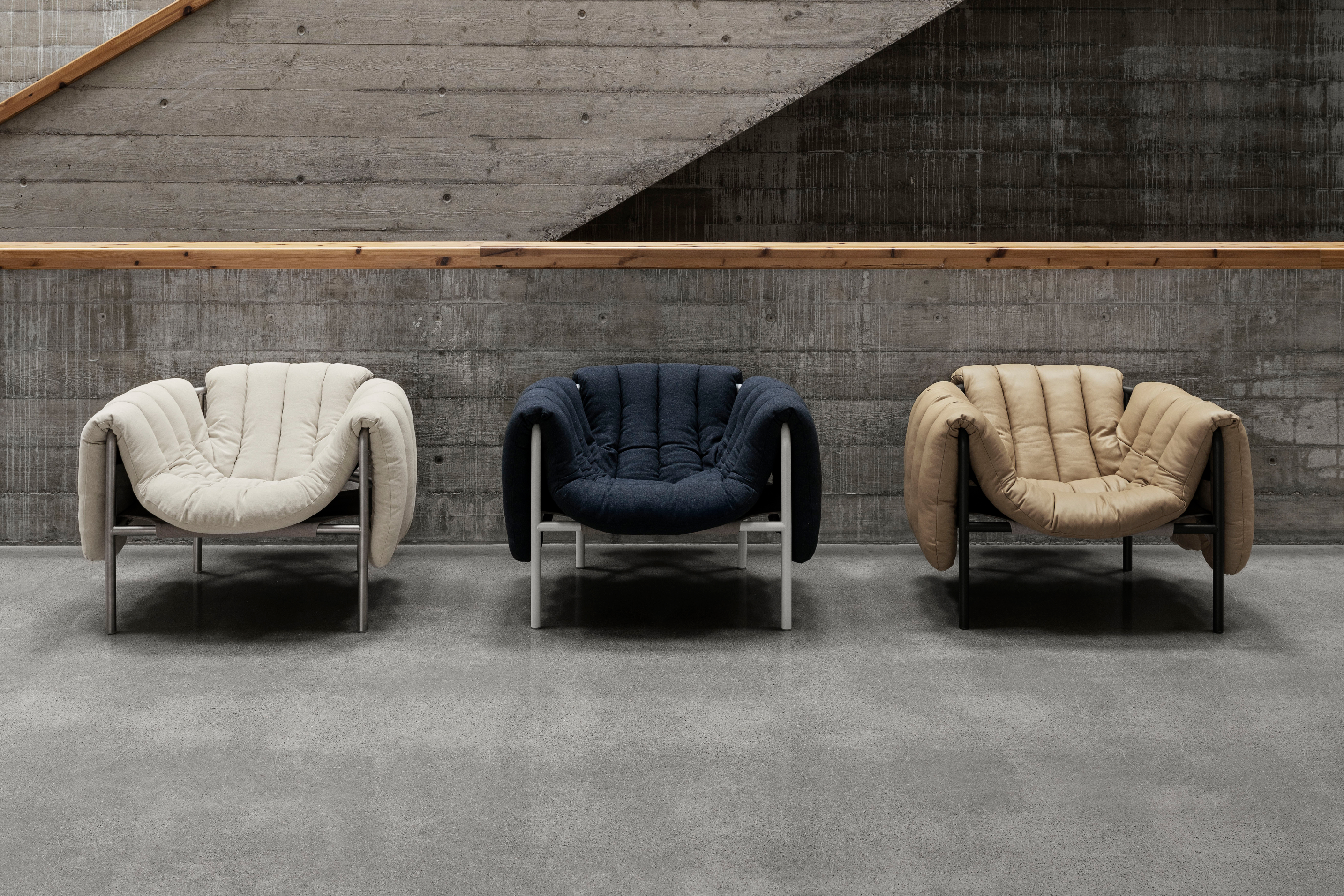 A lifestyle image of a lounge scene featuring Puffy Lounge Chairs.