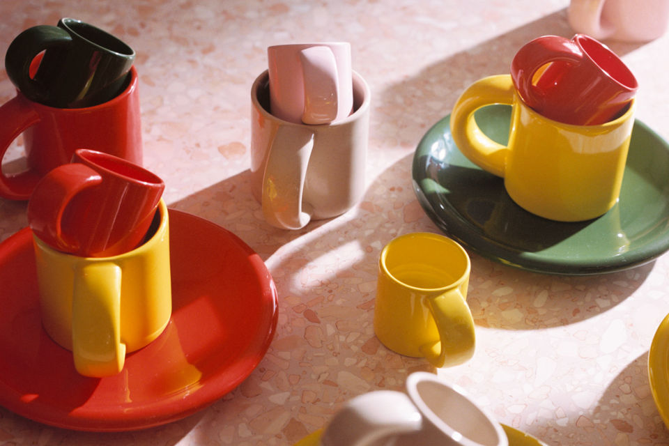 A lifestyle image of a dining scene featuring Bronto Tableware - Espresso Cups, Mugs and Plates.