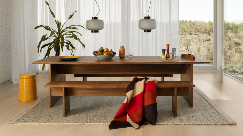 Hem - Lifestyle image of a dining room scene featuring Dusk Lamp, Dune Rug, Offcut Plate, Block Throw, Last Stool and Bookmatch Table + Benches Set.