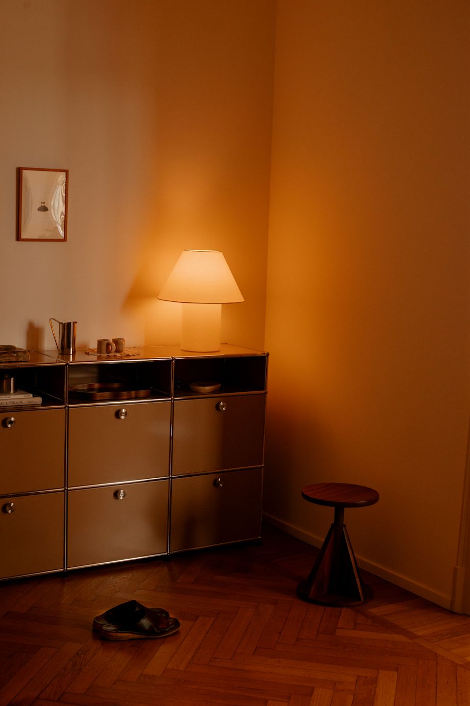 A lifestyle image featuring All Wood Stool, Toto Table Lamp Medium, and Bronto Espresso Cups.