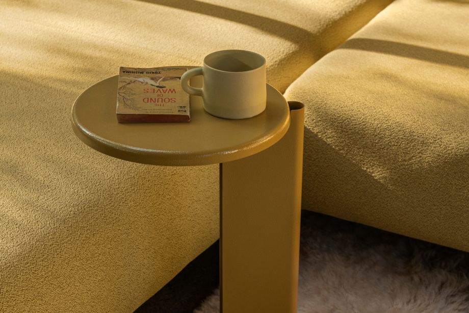A lifestyle image of a lounge scene featuring Lolly Side Table Ochre Yellow and Palo Modular Sofa Sunflower.