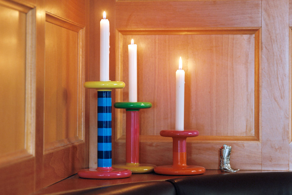 A lifestyle image of a dining scene featuring Pesa Candle Holders.