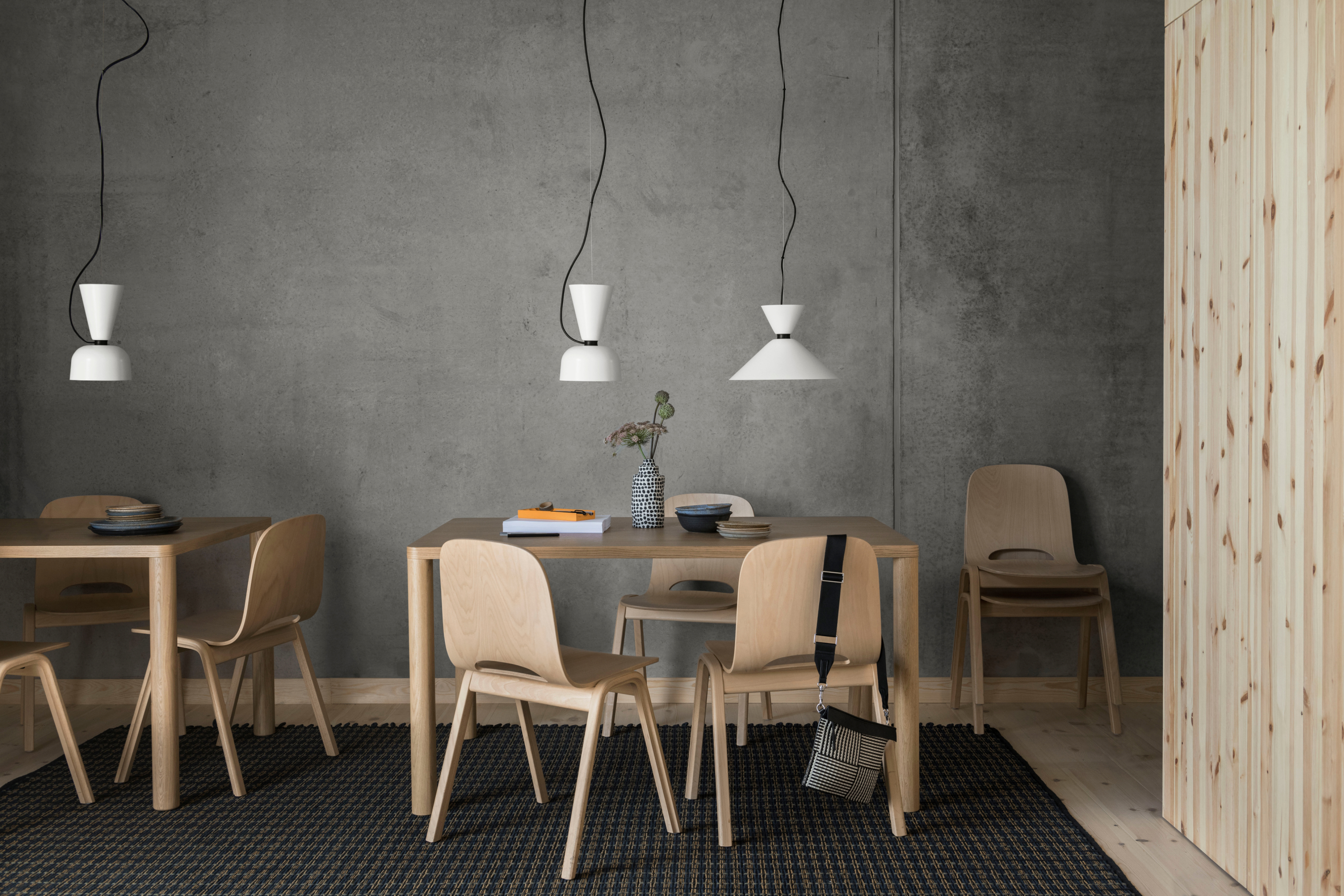 Hem - A lifestyle image featuring Log Table, Touchwood Chair, Alphabeta Pendant Light Duet, and Rope Rug.