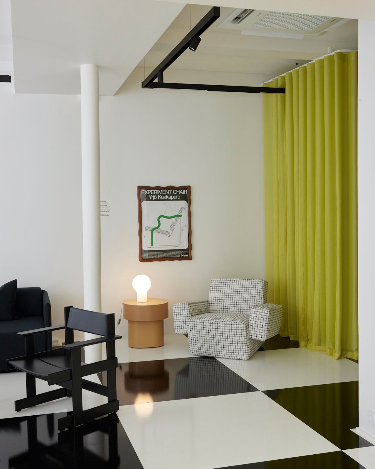An image from 3daysofdesign in Copenhagen featuring Stump Side Table, Coco Table Lamp, Experiment Chair poster, Wiggle Frame, Hunk Lounge Chair with Armrests, and Bullnose Dining Chair.