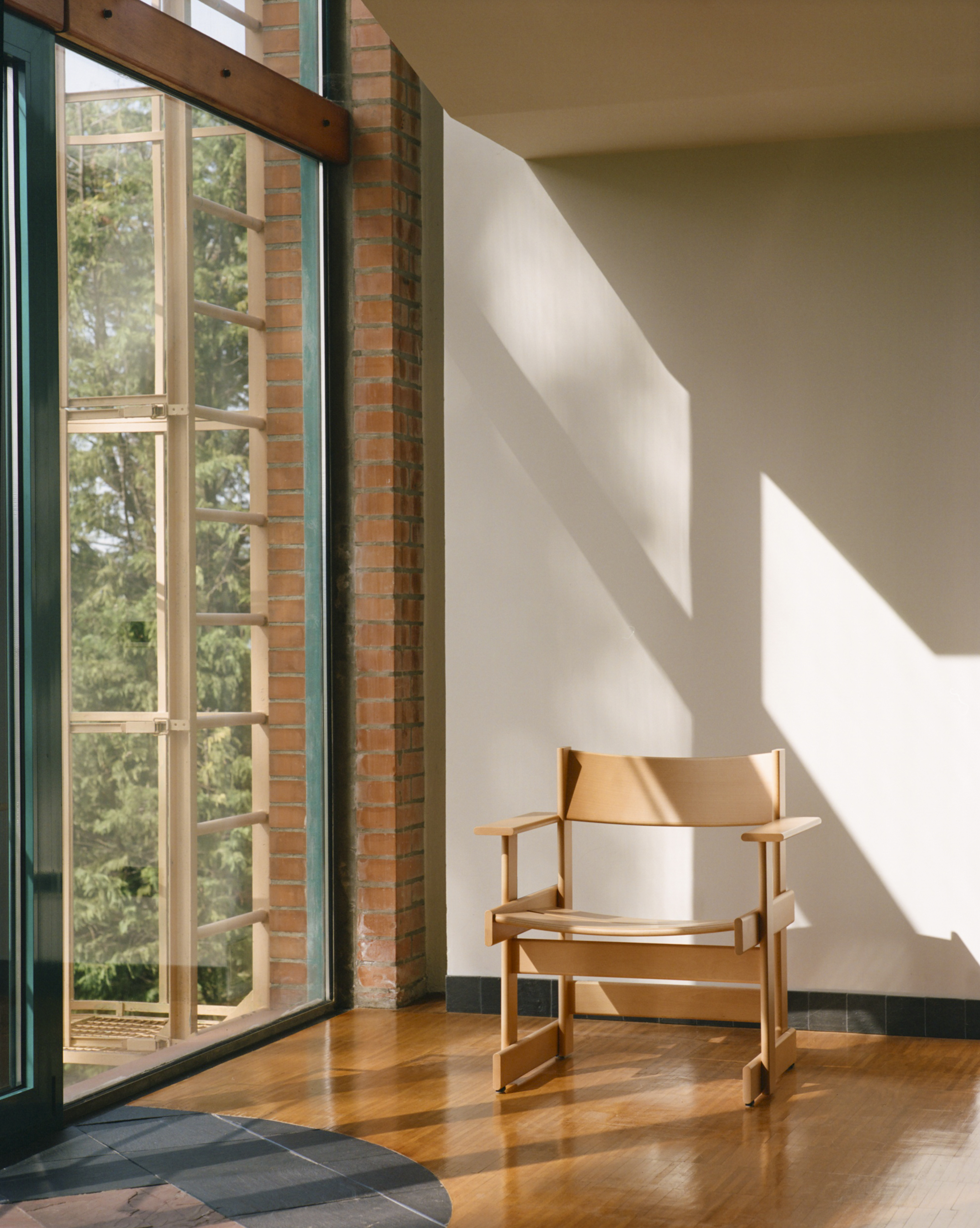 A lifestyle image of a lounge scene featuring Bullnose Lounge Chair.